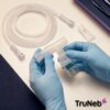 Clinician hands inspecting a disposable nebulizer kit and mouthpiece connection.